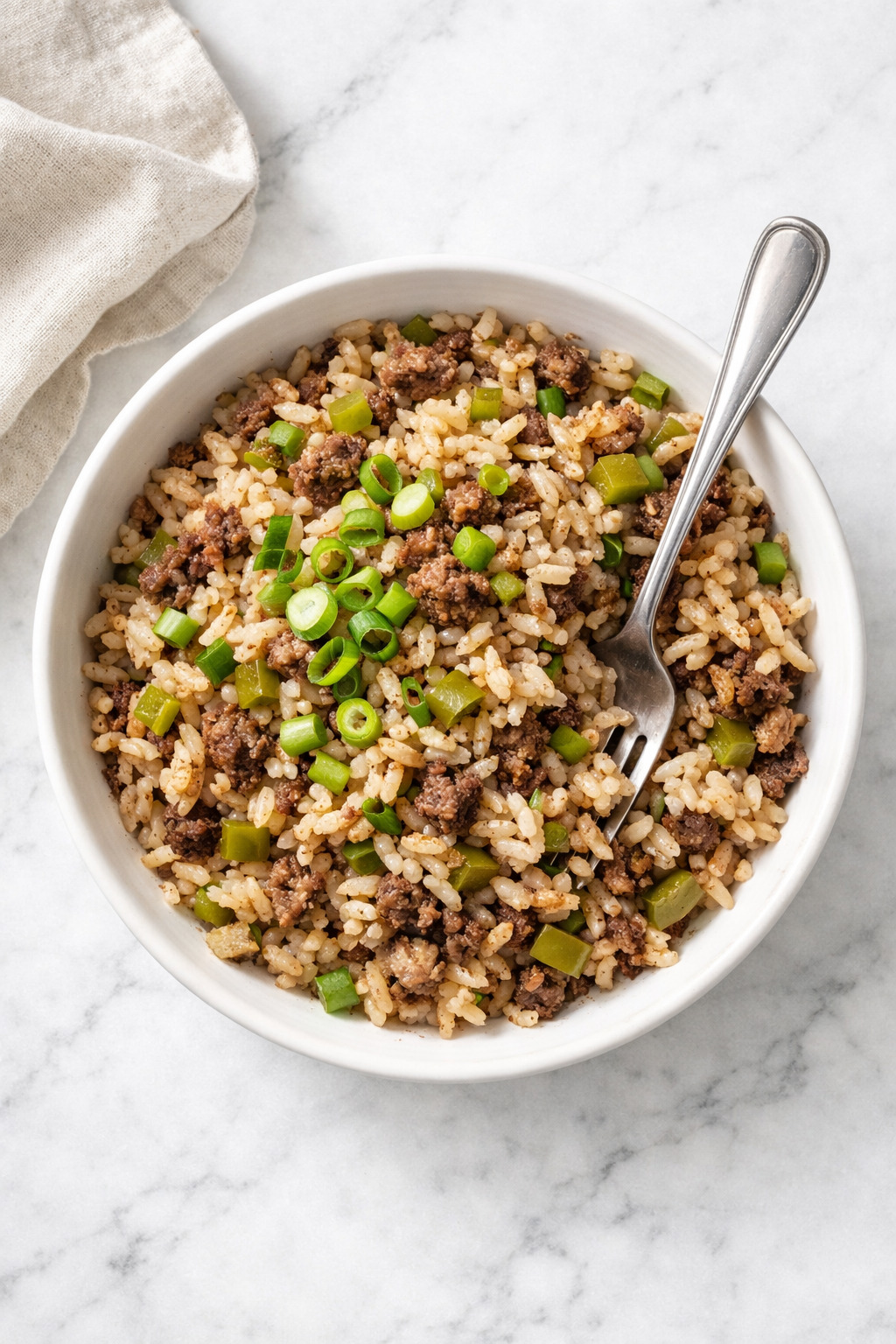 Overhead view of dirty rice with ground beef and cajun seasonings